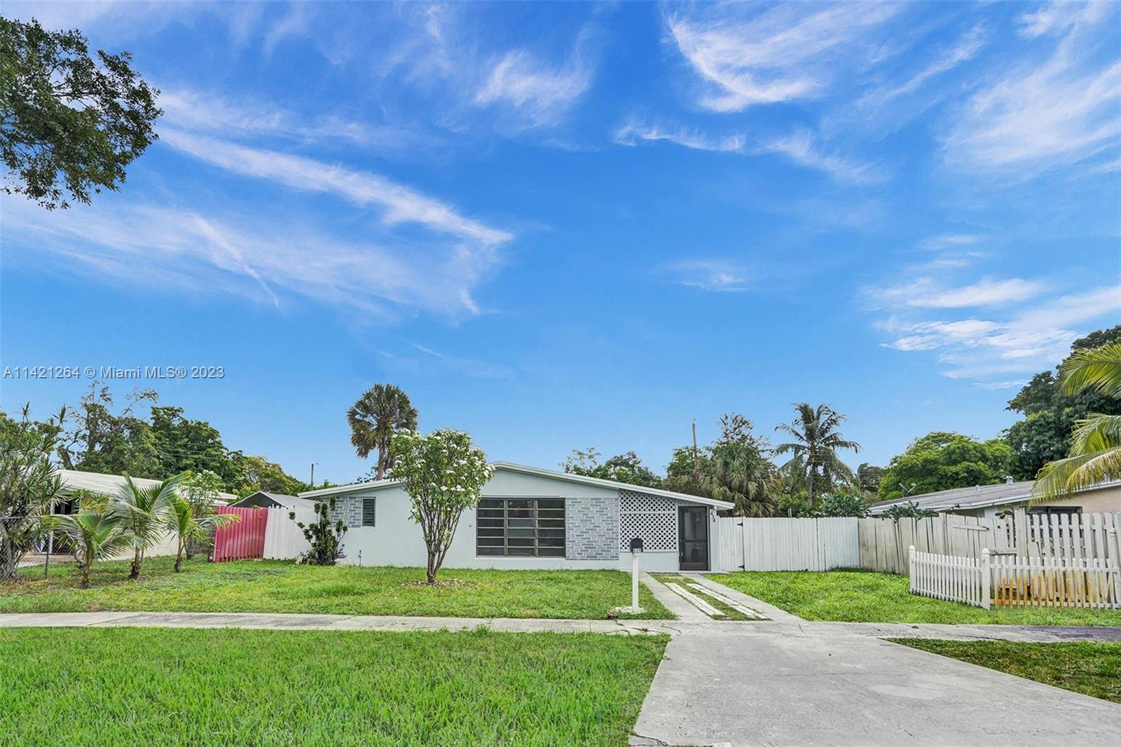 434 Southwest 22nd Terrace Fort Lauderdale, FL 33312 - Photo 14 of 15 a front view of a house with a yard