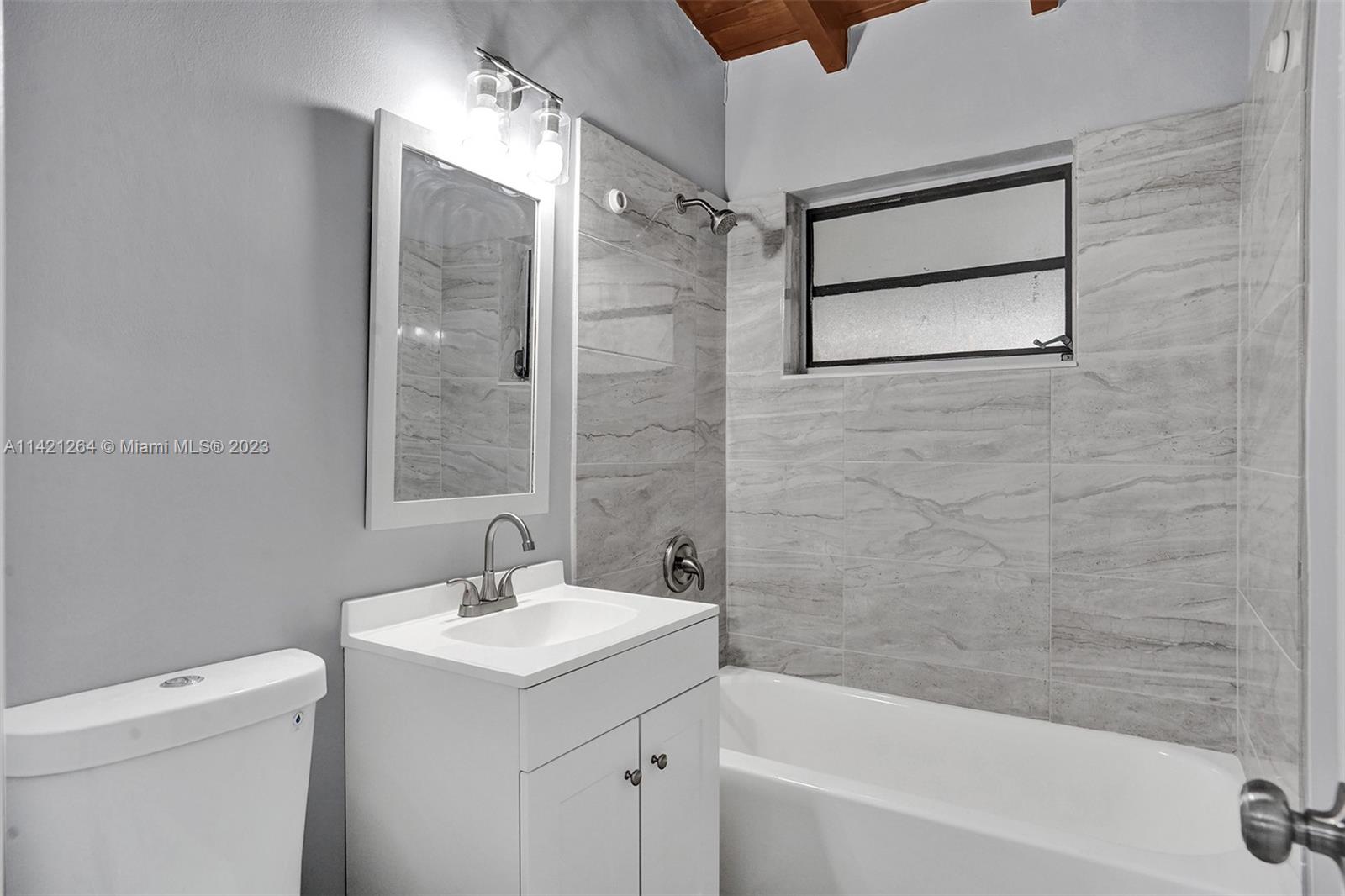 434 Southwest 22nd Terrace Fort Lauderdale, FL 33312 - Photo 8 of 15 a bathroom with a sink a toilet and shower