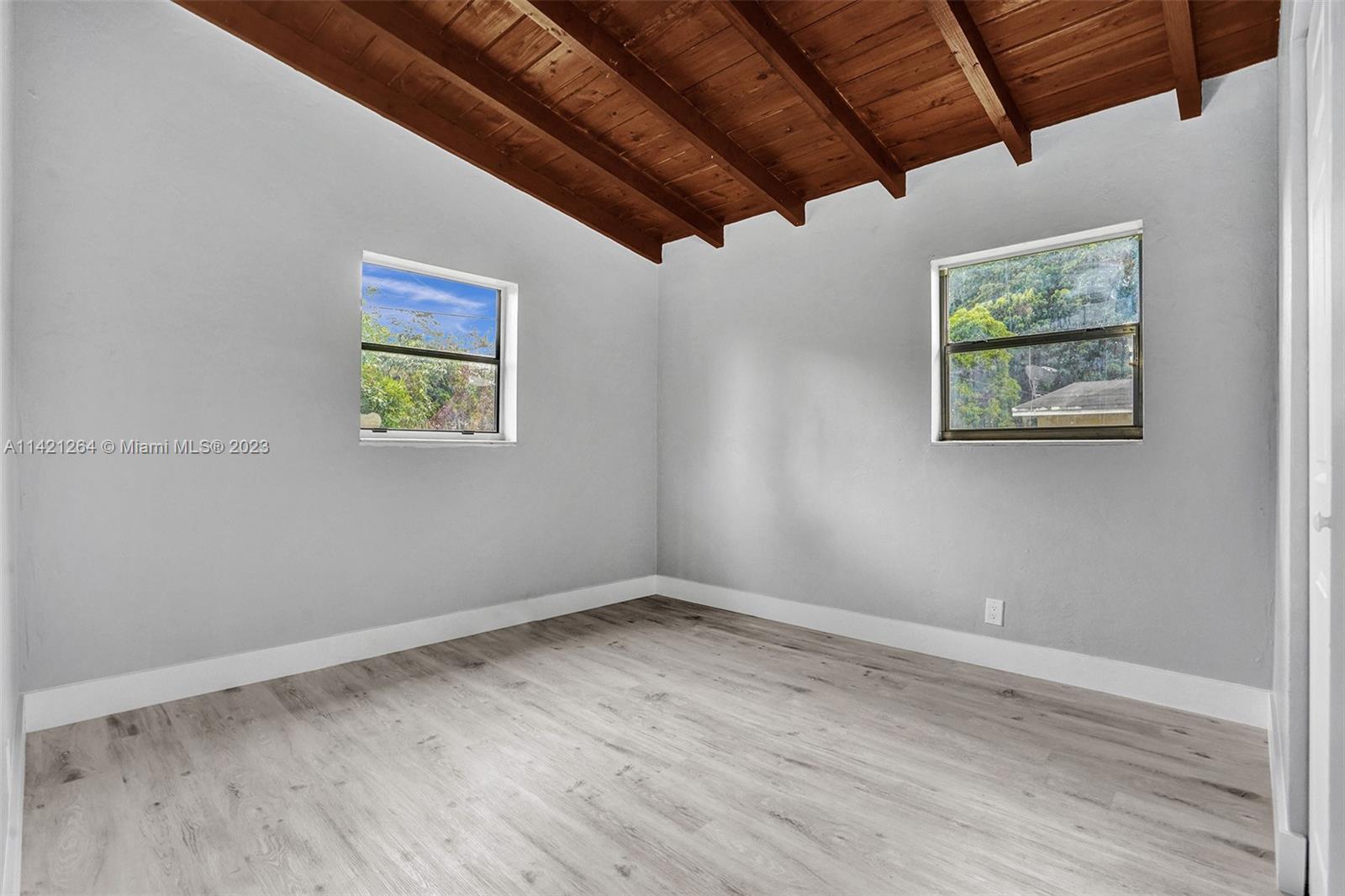 434 Southwest 22nd Terrace Fort Lauderdale, FL 33312 - Photo 9 of 15 a view of room with window and hardwood floor