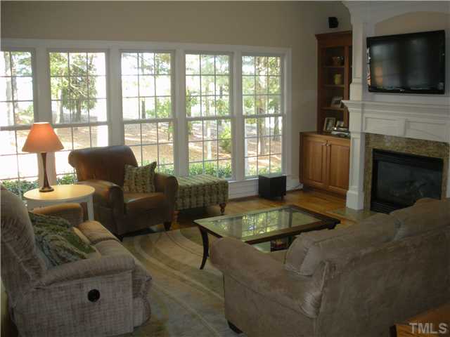 1124 Colonial Club Road Wake Forest, NC 27587 - Photo 9 of 25 Living room overlooking the pines and 2nd Fairway....no home is behind this one! It is a beautiful lot with gorgeous vistas!