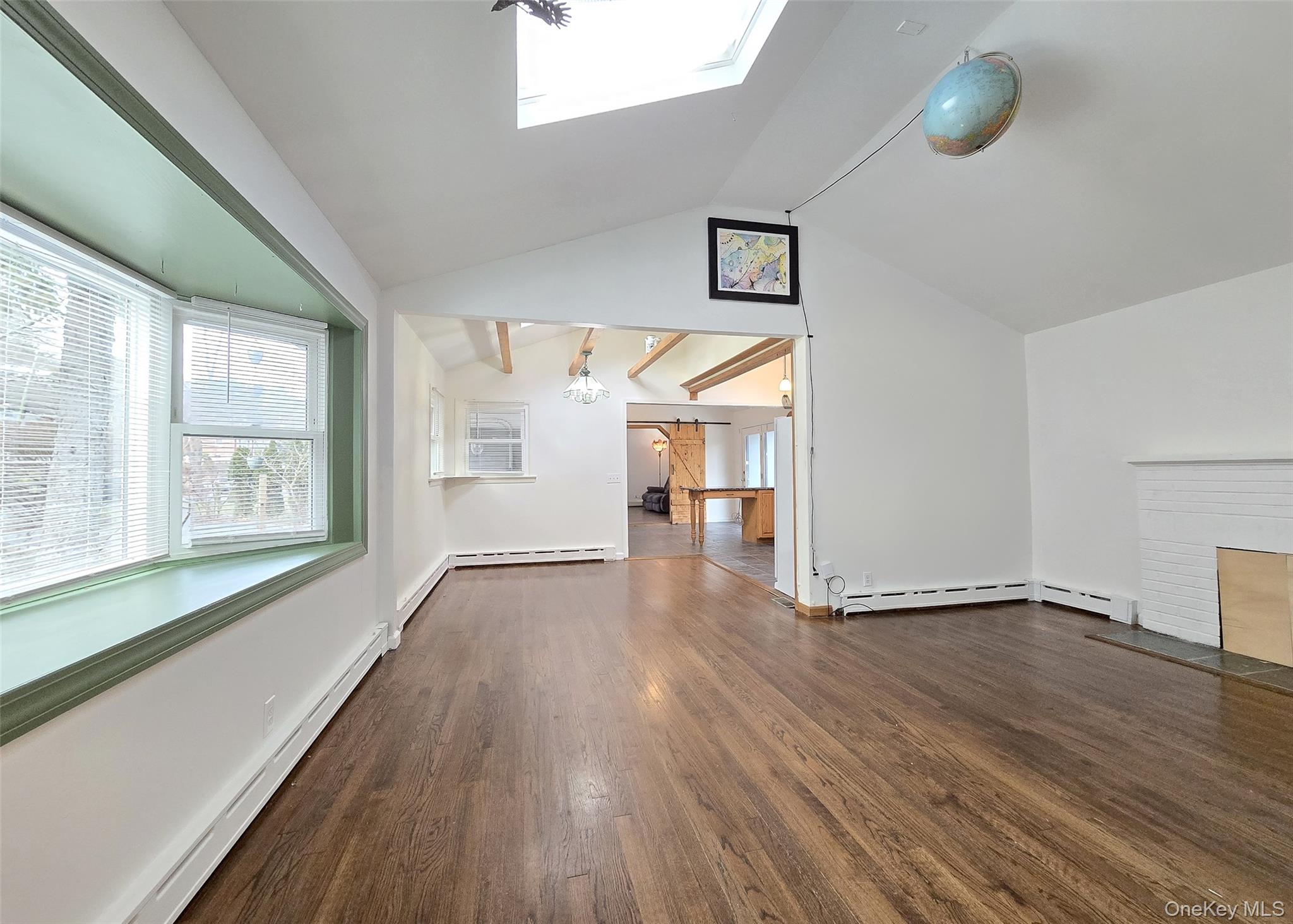 27 Forest Trail Ridge, NY 11961 - Photo 12 of 29 Hardwood Flooring & Skylight.