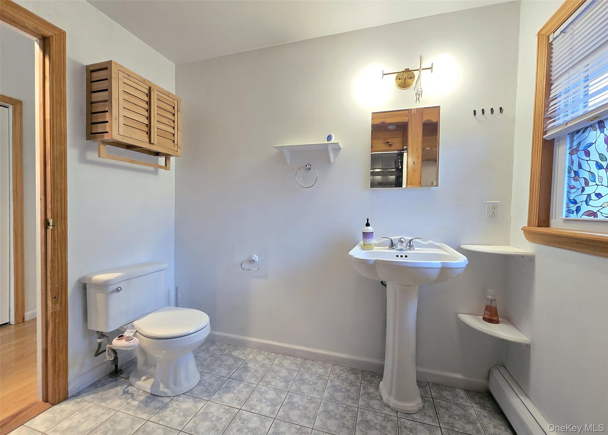 27 Forest Trail Ridge, NY 11961 - Photo 19 of 29 Pedestal Sink & Tile Flooring.