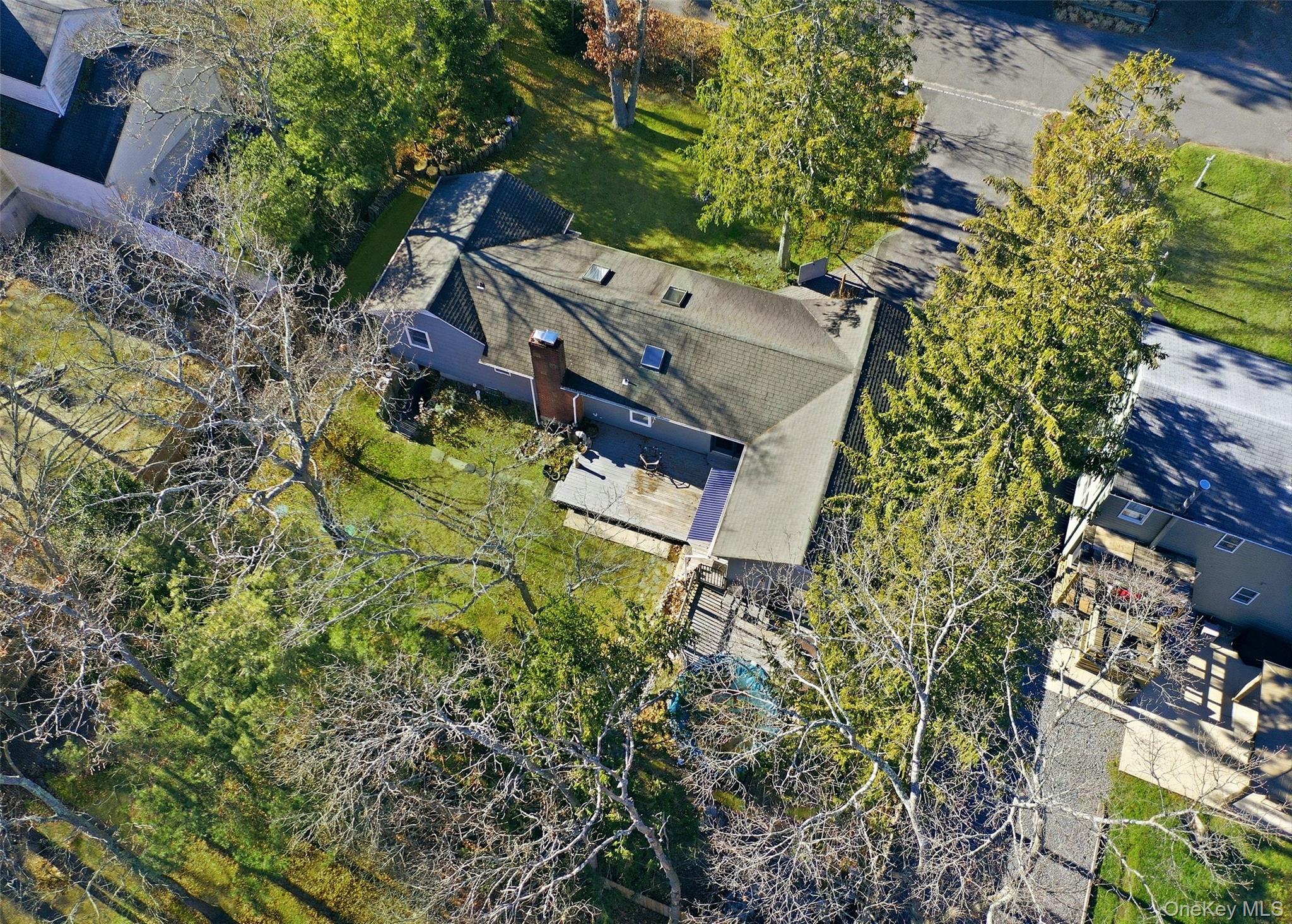 27 Forest Trail Ridge, NY 11961 - Photo 26 of 29 An Additional Deck For Entertaining Guests Is Along The Back Of The House Along With An Awning.