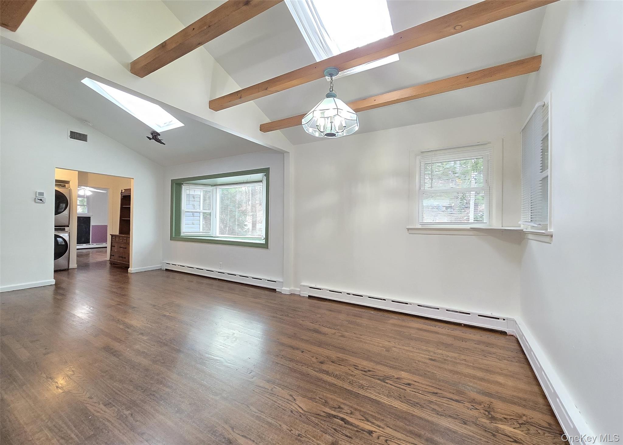 27 Forest Trail Ridge, NY 11961 - Photo 10 of 29 The Dining Rm Flows Into The Living Room.