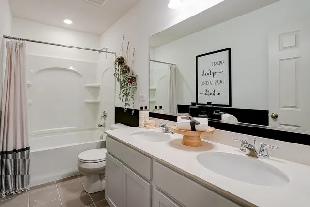 a bathroom with a bathtub and a window