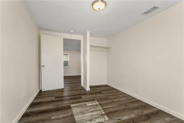 a view of a livingroom from the hallway