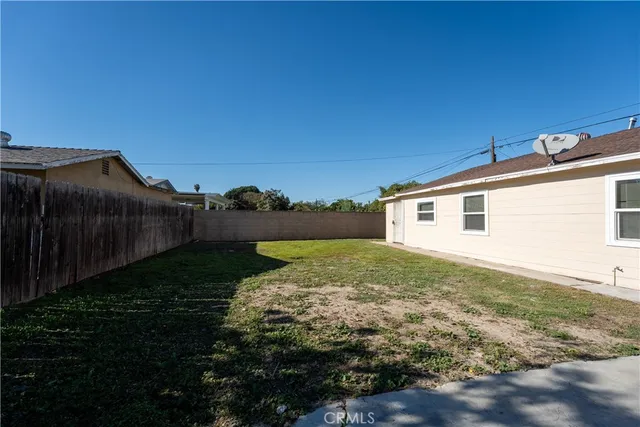 a big house with a big yard and more large trees
