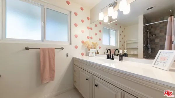 a bathroom with a sink and a mirror