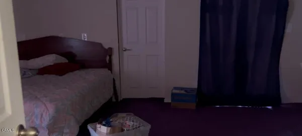 a gym room with gym equipment and windows