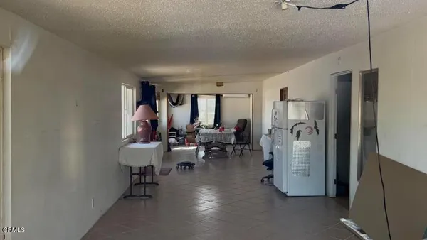 a view of workspace with furniture and window
