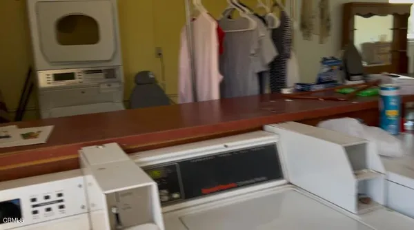 a bathroom with a shower and a sink