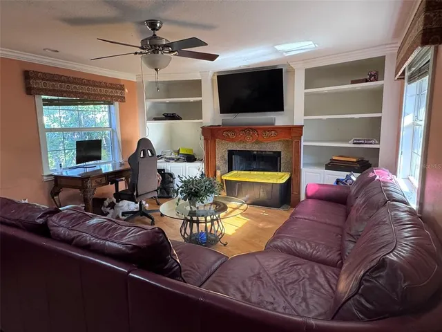 a living room with furniture and a fireplace