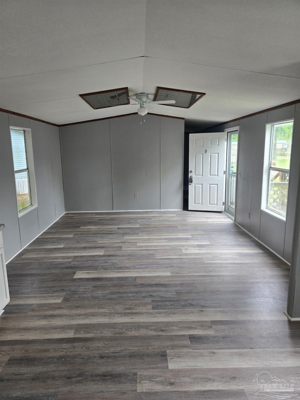 5675 Saufley Field Road, Unit 9 Pensacola, FL 32526 - Photo 12 of 15 a view of an empty room with windows