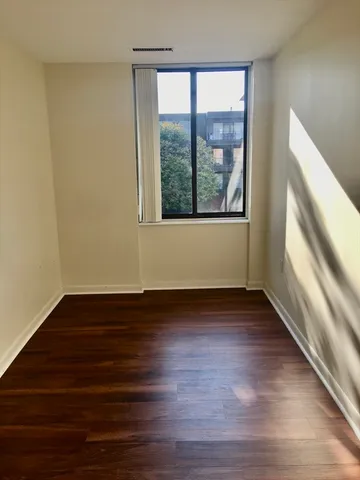 a bedroom with a bed and a table