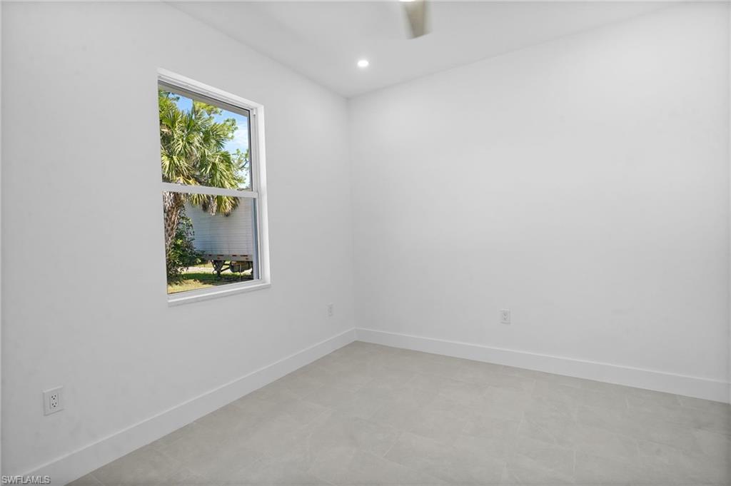 2936 40th Avenue Southeast Naples, FL 34117 - Photo 22 of 49 Empty room featuring baseboards and recessed lighting