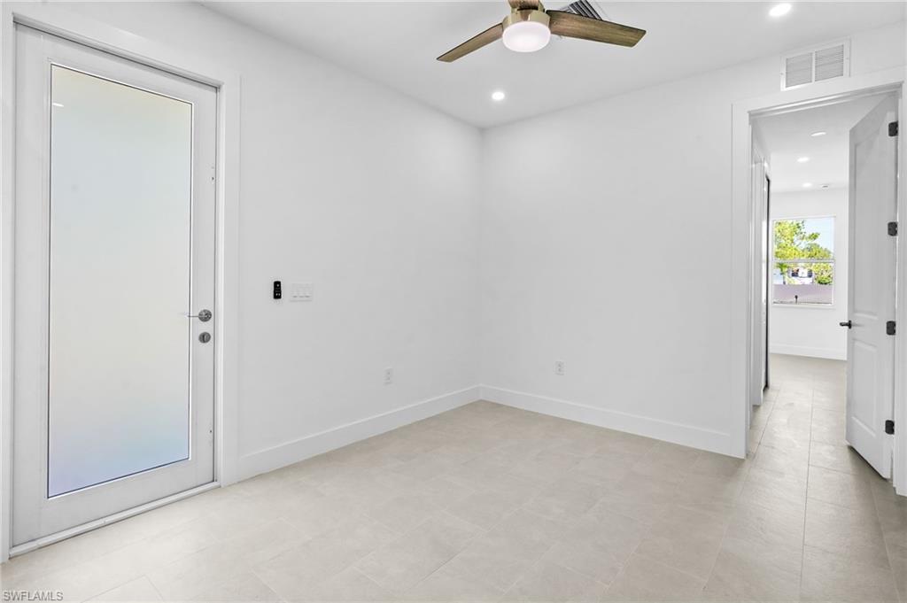 2936 40th Avenue Southeast Naples, FL 34117 - Photo 29 of 49 Empty room with recessed lighting and a ceiling fan