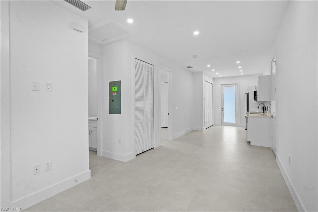 2936 40th Avenue Southeast Naples, FL 34117 - Photo 3 of 49 Hall featuring recessed lighting and electric panel