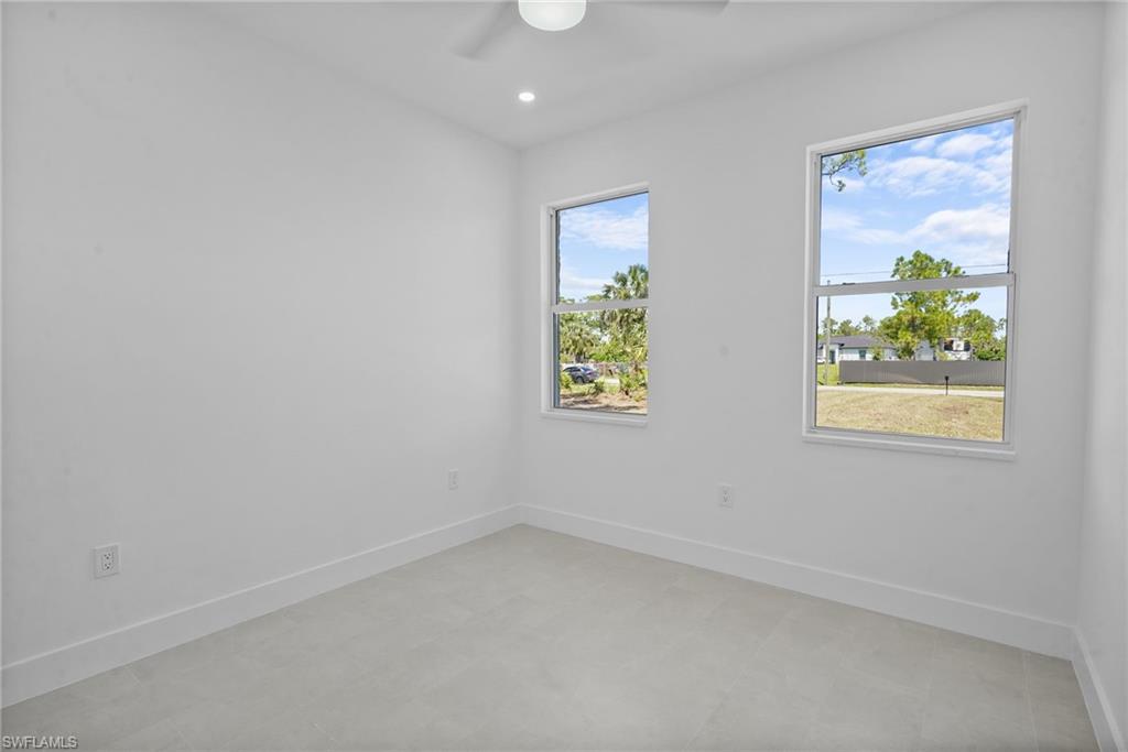2936 40th Avenue Southeast Naples, FL 34117 - Photo 34 of 49 Empty room featuring a ceiling fan and recessed lighting