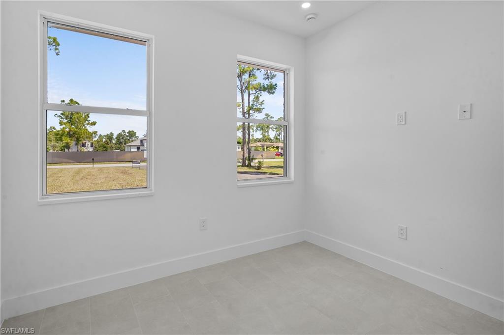 2936 40th Avenue Southeast Naples, FL 34117 - Photo 37 of 49 Empty room with baseboards