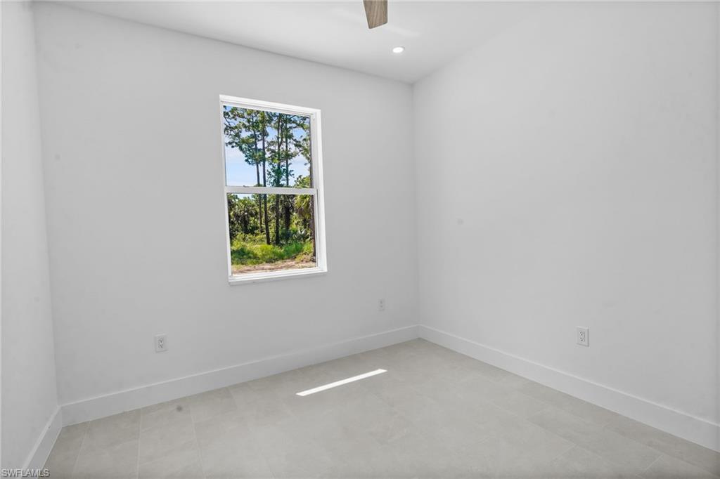 2936 40th Avenue Southeast Naples, FL 34117 - Photo 39 of 49 Empty room featuring recessed lighting and ceiling fan