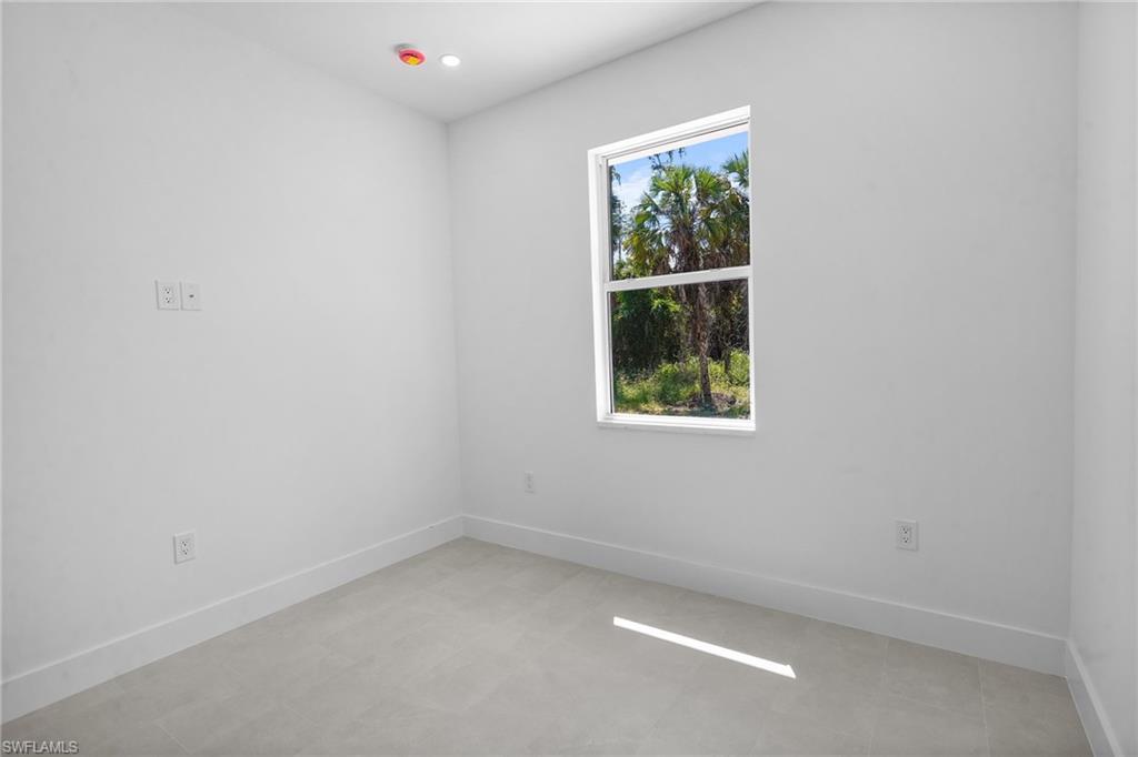 2936 40th Avenue Southeast Naples, FL 34117 - Photo 40 of 49 Empty room with baseboards and recessed lighting