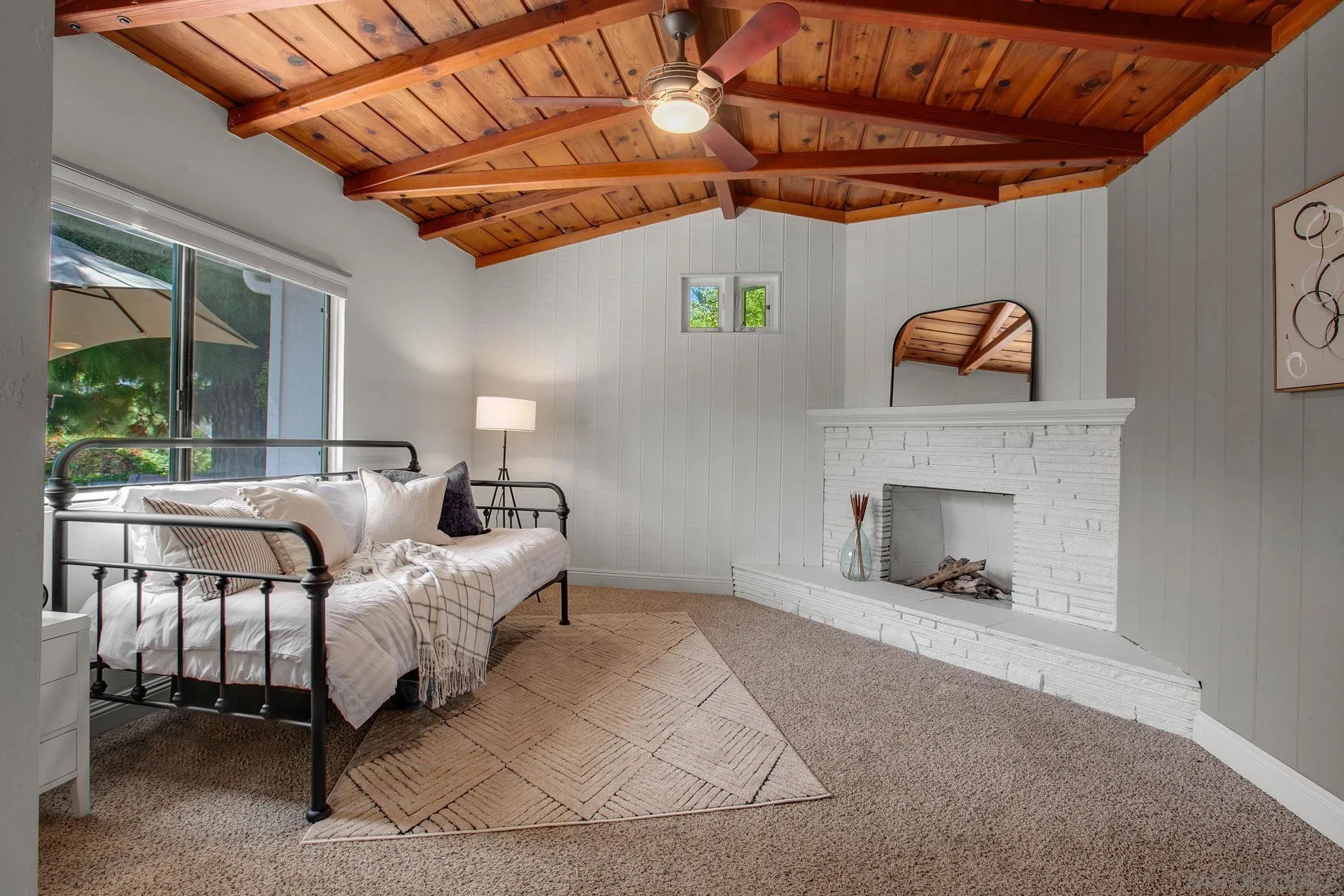 1625 Eolus Avenue Encinitas, CA 92024 - Photo 18 of 37 a bedroom with furniture and a fireplace