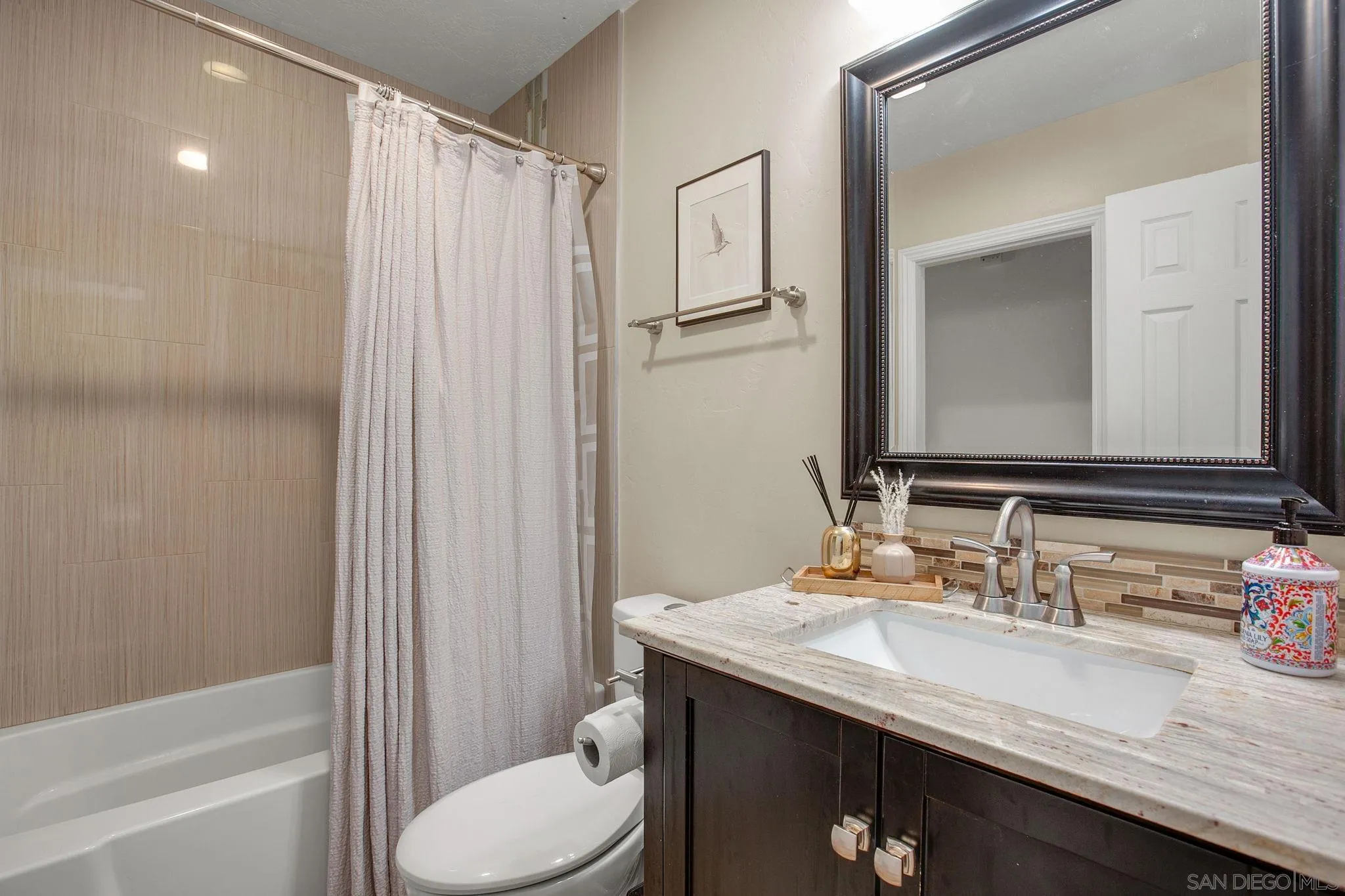 1625 Eolus Avenue Encinitas, CA 92024 - Photo 20 of 37 a bathroom with a granite countertop sink toilet and shower