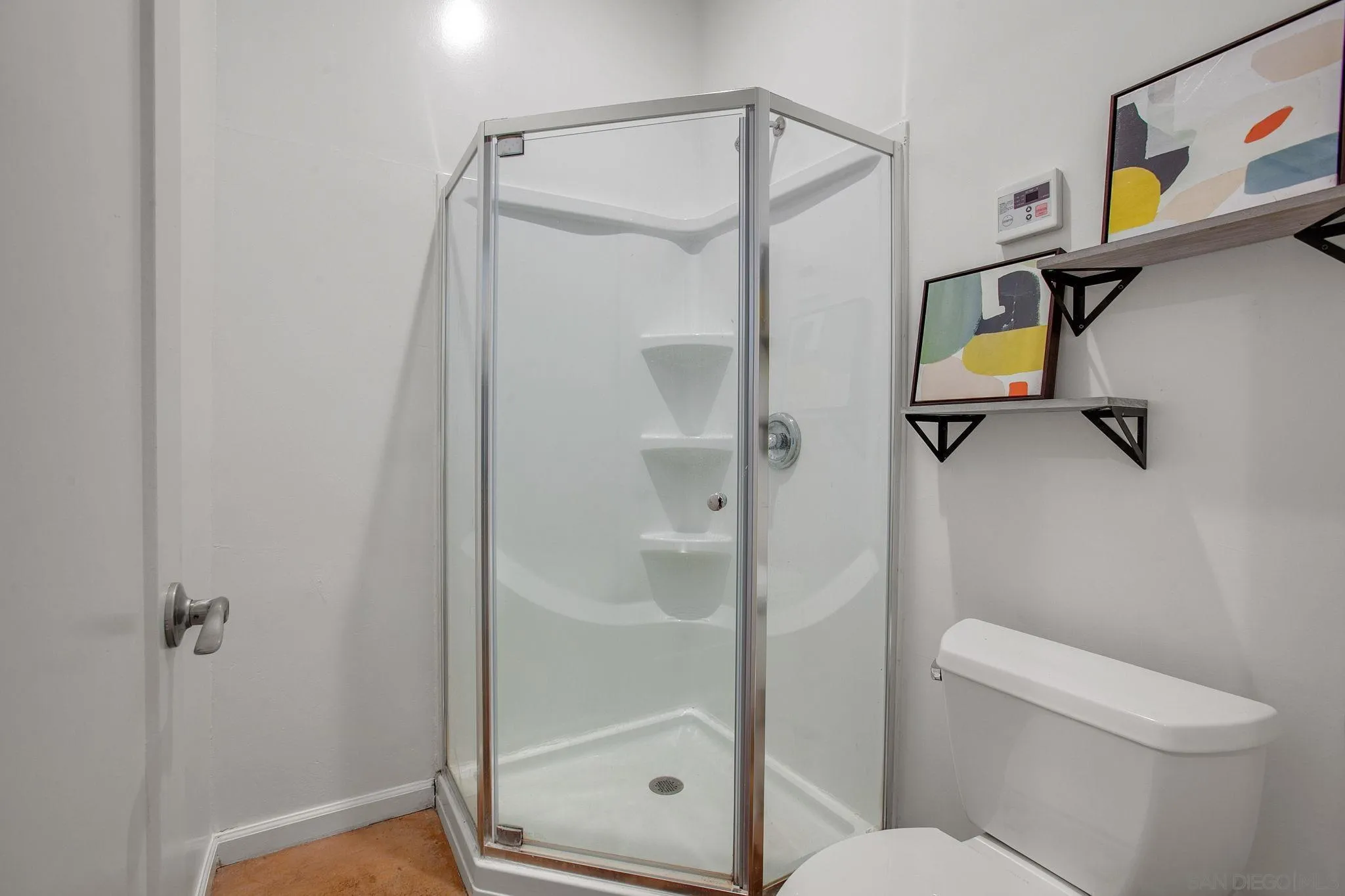 1625 Eolus Avenue Encinitas, CA 92024 - Photo 25 of 37 a bathroom with a shower and toilet