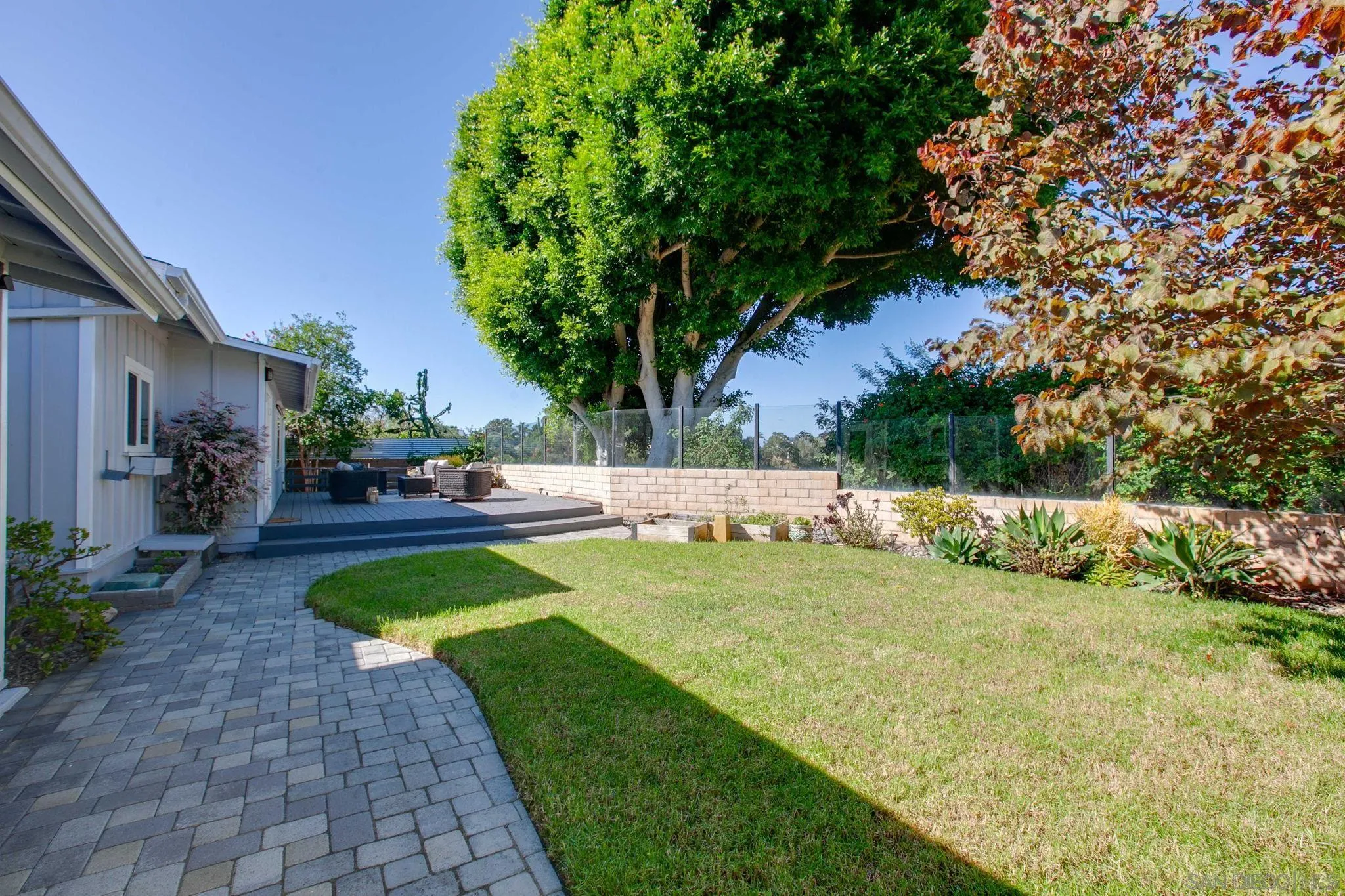 1625 Eolus Avenue Encinitas, CA 92024 - Photo 28 of 37 a view of backyard with swimming pool and seating space