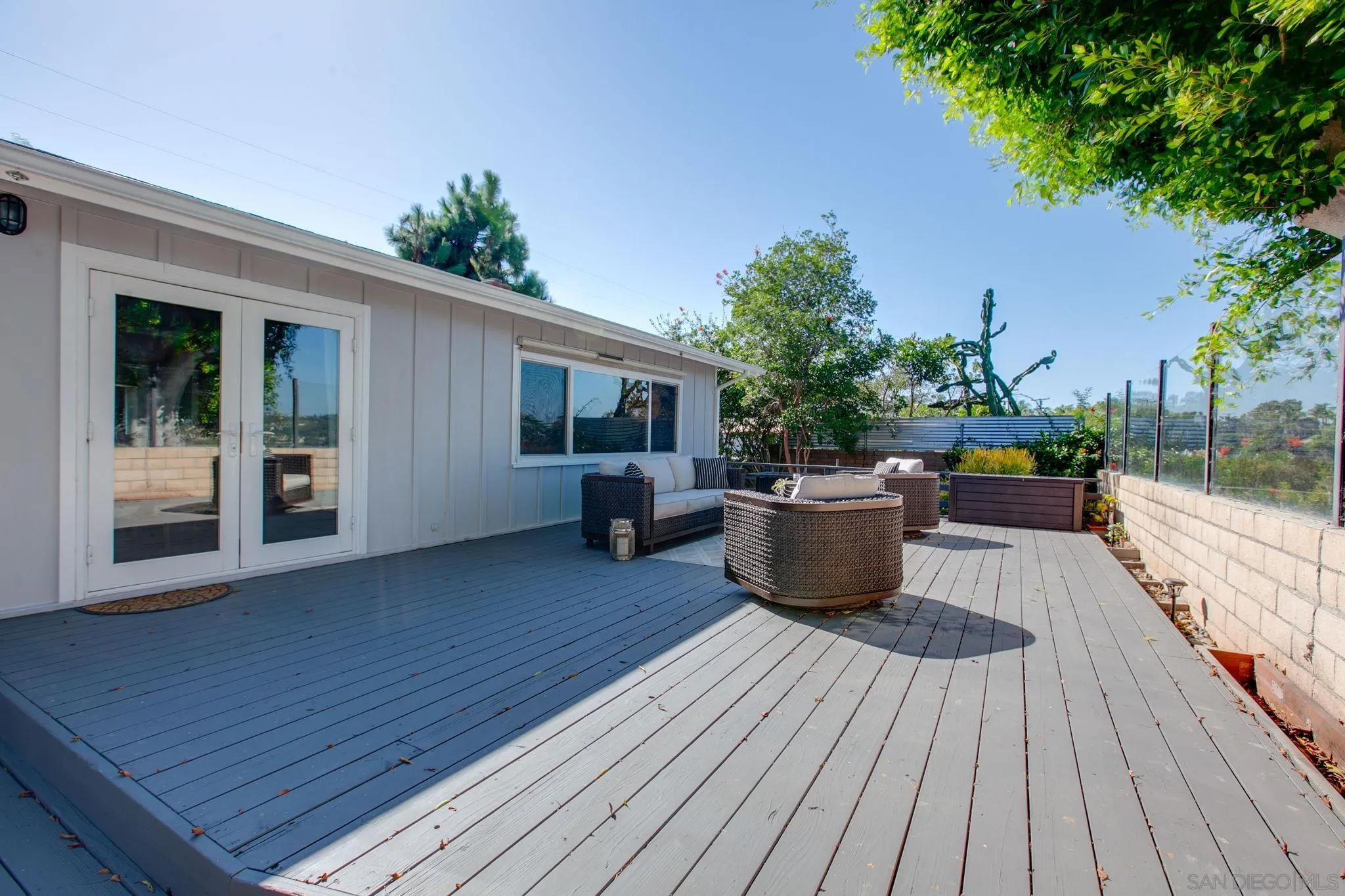 1625 Eolus Avenue Encinitas, CA 92024 - Photo 30 of 37 a view of a roof deck with table and chairs potted plants with wooden floor