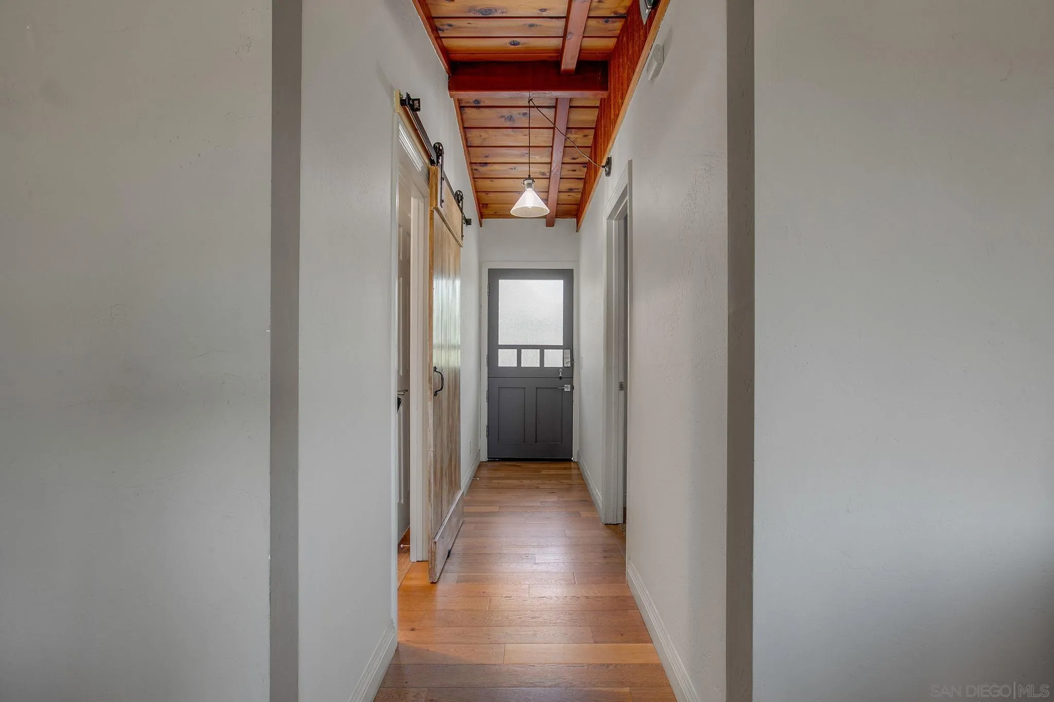 1625 Eolus Avenue Encinitas, CA 92024 - Photo 5 of 37 a view of a hallway with wooden floor and staircase