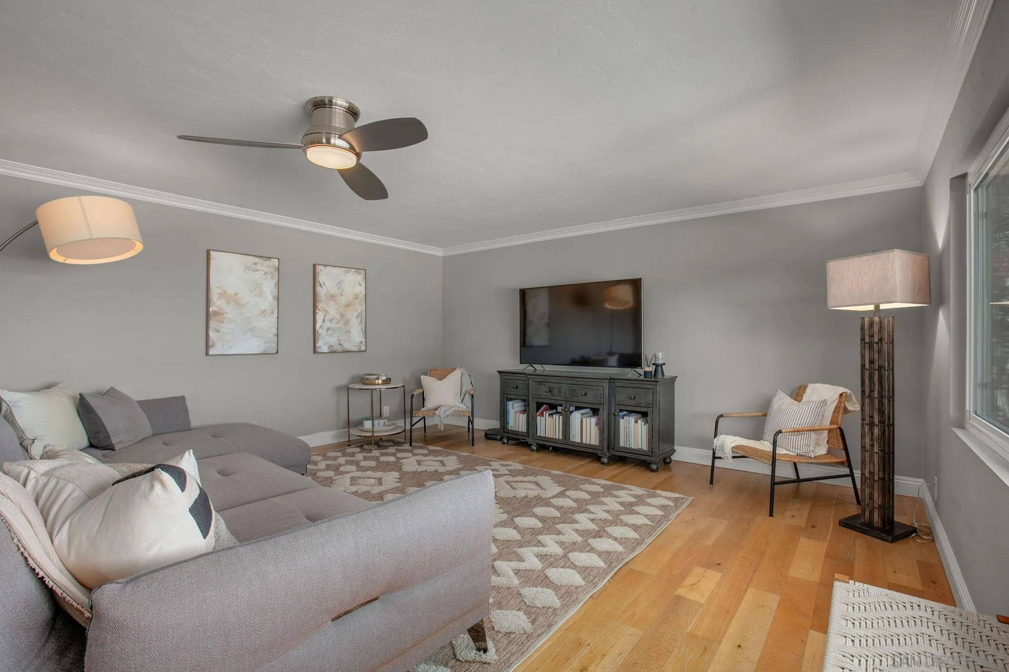 1625 Eolus Avenue Encinitas, CA 92024 - Photo 10 of 37 a living room with furniture and a flat screen tv