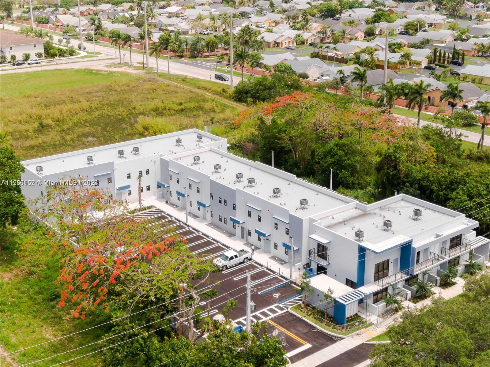 24705 Southwest 129th Avenue, Unit 109 Homestead, FL 33032 - Photo 21 of 22 a view of a city with an ocean view
