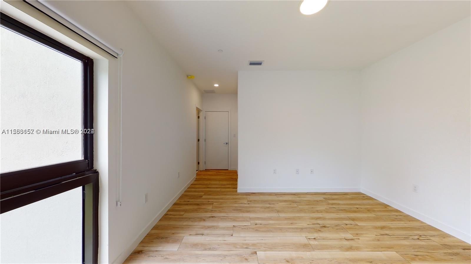 24705 Southwest 129th Avenue, Unit 109 Homestead, FL 33032 - Photo 7 of 22 a view of an empty room