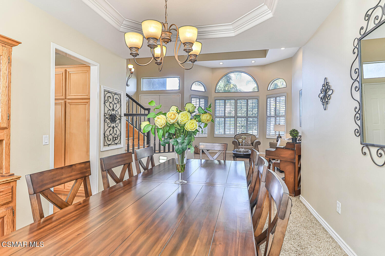 58 Mollison Drive Simi Valley, CA 93065 - Photo 18 of 82 a view of a dining room with furniture a chandelier and wooden floor