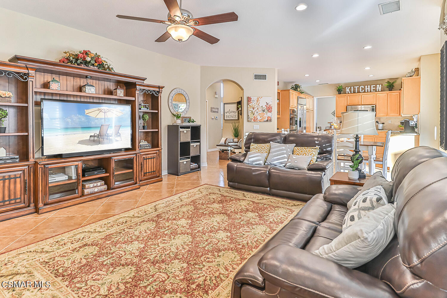 58 Mollison Drive Simi Valley, CA 93065 - Photo 26 of 82 a living room with furniture a flat screen tv and a fireplace
