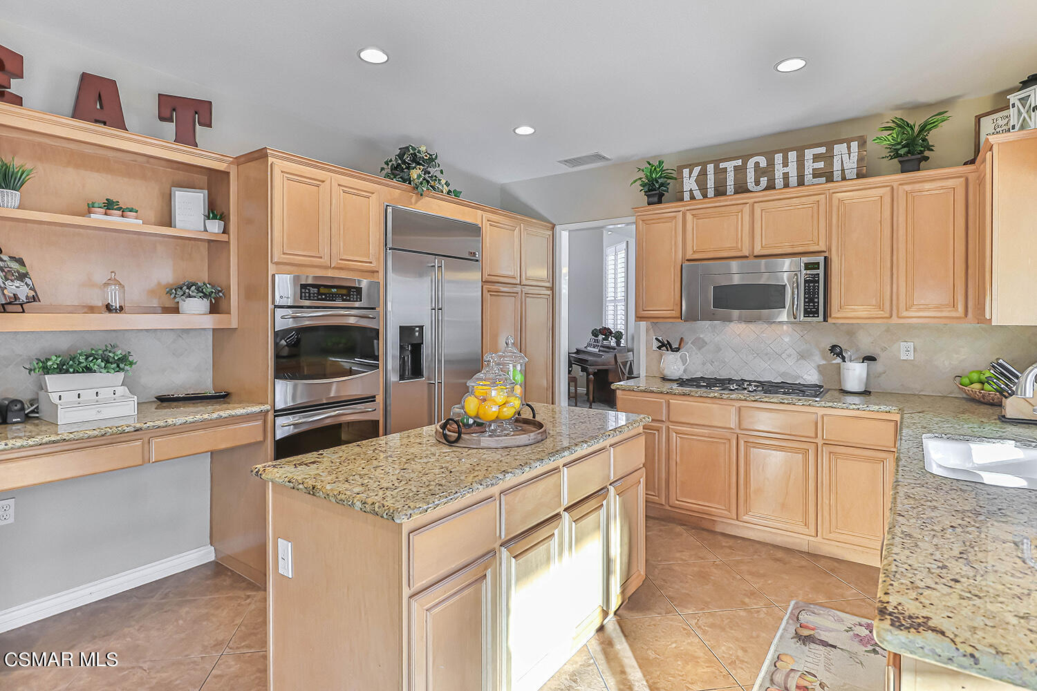 58 Mollison Drive Simi Valley, CA 93065 - Photo 29 of 82 a kitchen with stainless steel appliances granite countertop a stove top oven a sink a counter space and cabinets