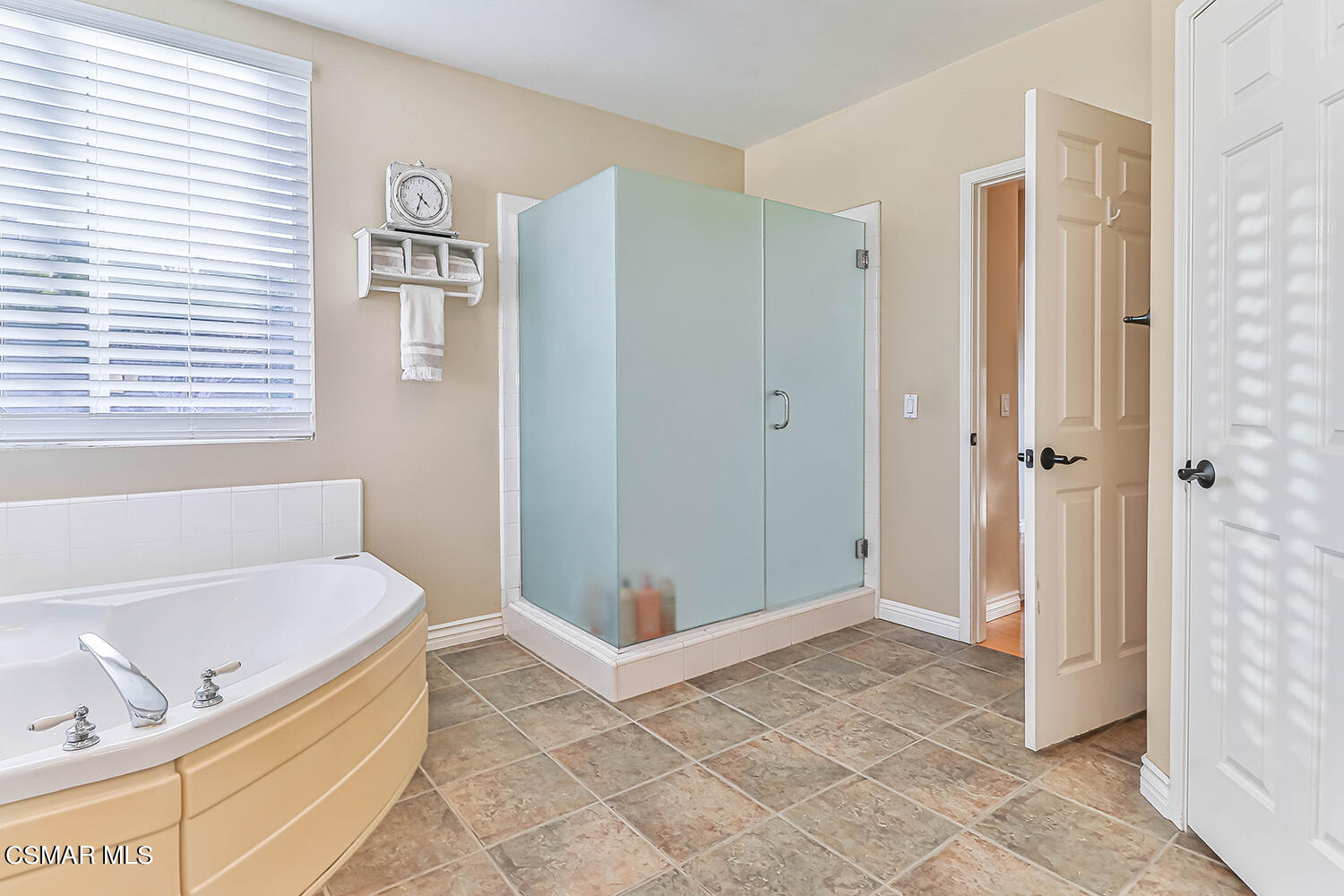 58 Mollison Drive Simi Valley, CA 93065 - Photo 45 of 82 a bathroom with a tub shower and sink