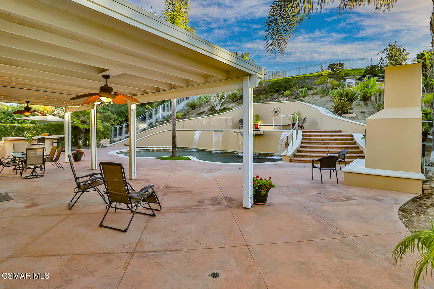 58 Mollison Drive Simi Valley, CA 93065 - Photo 54 of 82 a view of a patio with table and chairs potted plants with wooden floor and seating space