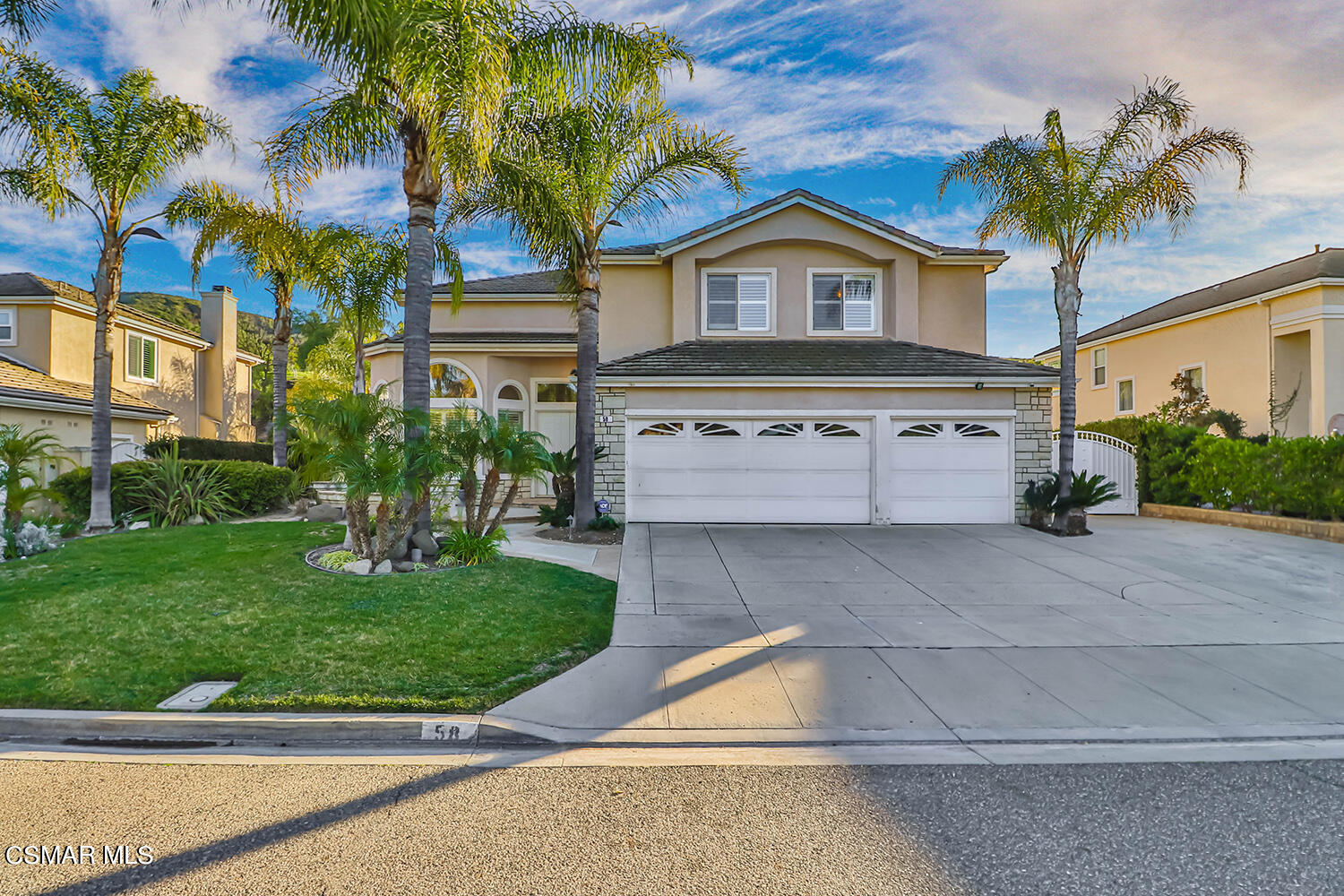 58 Mollison Drive Simi Valley, CA 93065 - Photo 6 of 82 a view of a white house with a big yard and potted plants