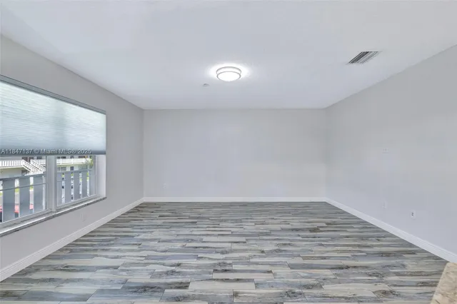 a view of a swimming pool with outdoor seating