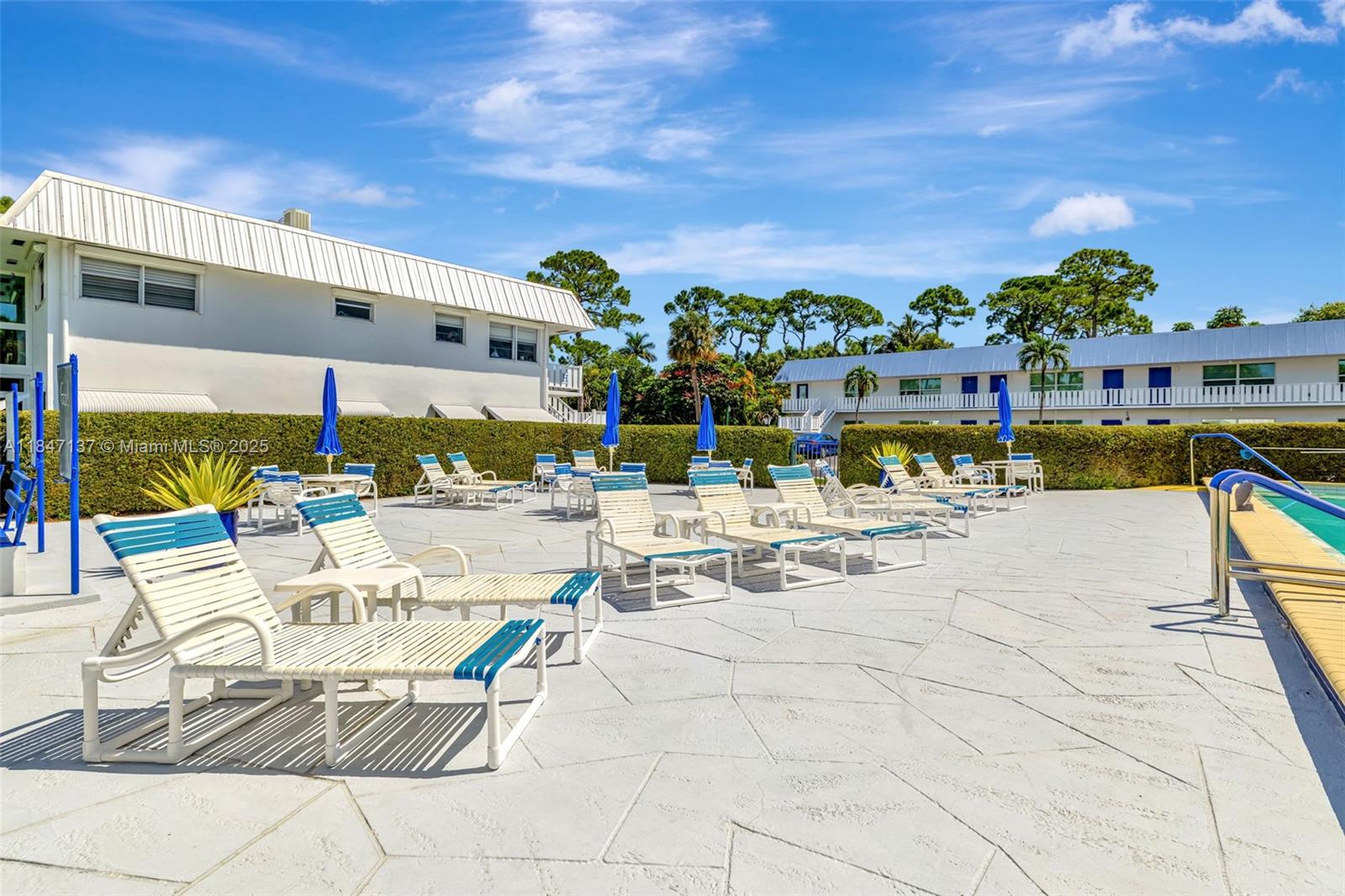 2929 Southeast Ocean Boulevard, Unit F6 Stuart, FL 34996 - Photo 19 of 42 a view of a swimming pool with outdoor seating