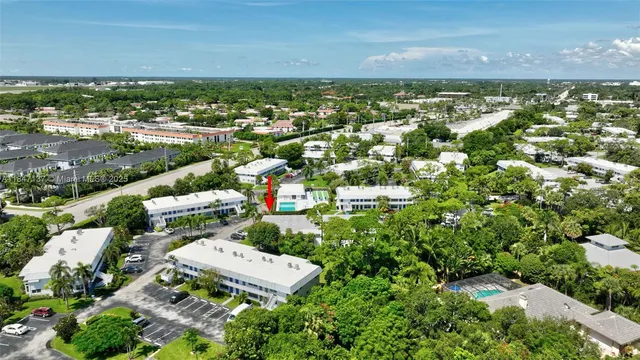 a house with lots of trees in the background