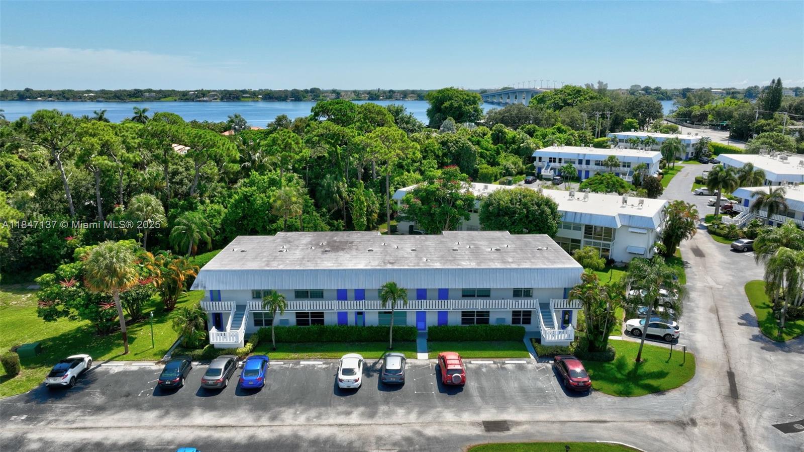 2929 Southeast Ocean Boulevard, Unit F6 Stuart, FL 34996 - Photo 33 of 42 an aerial view of a house with garden space and street view