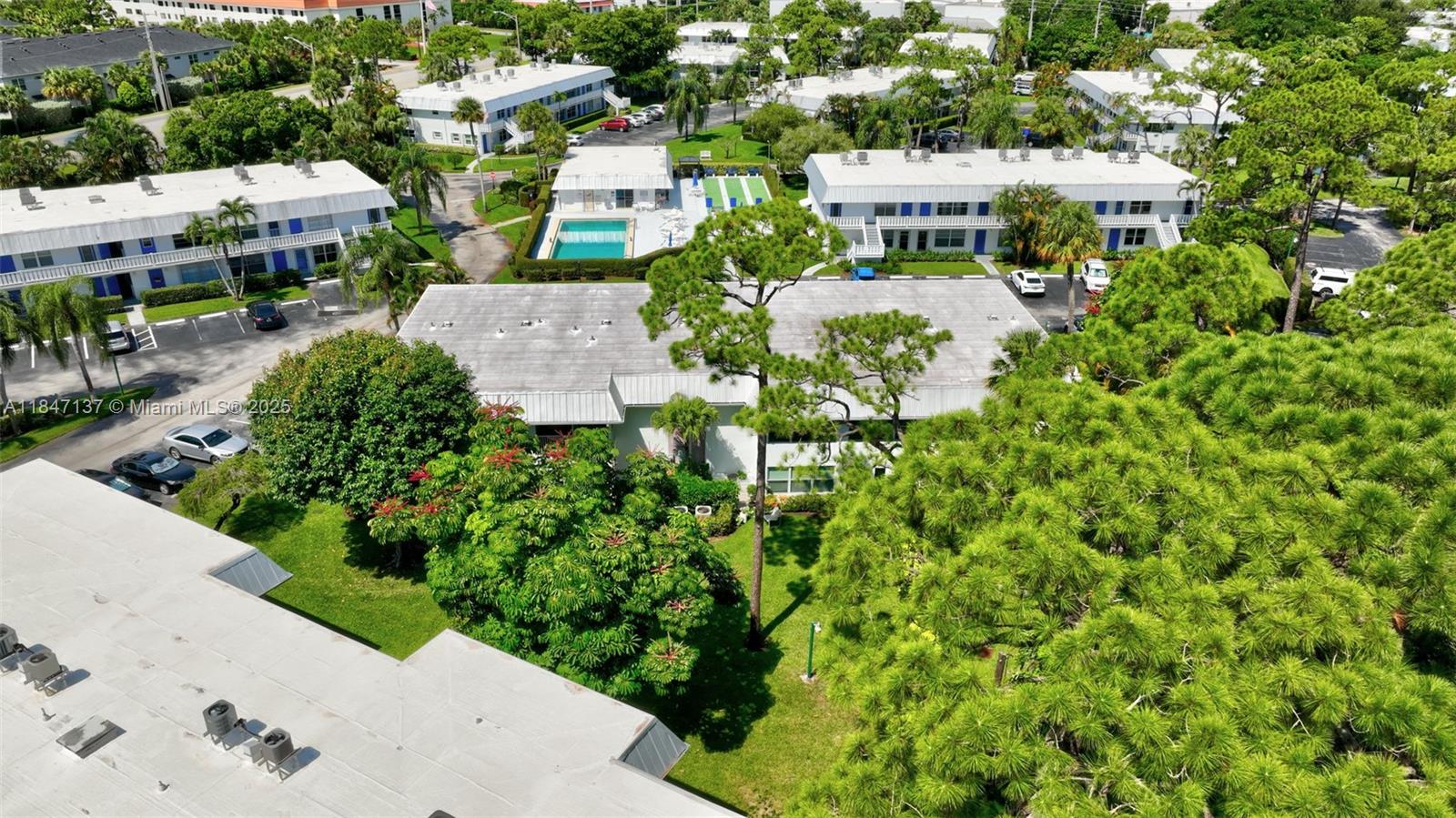 2929 Southeast Ocean Boulevard, Unit F6 Stuart, FL 34996 - Photo 38 of 42 an aerial view of multiple houses with yard
