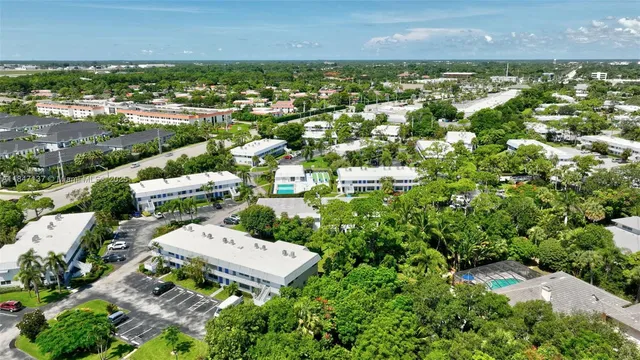 an aerial view of a house with swimming pool garden and patio
