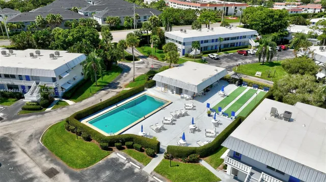 a living room with furniture a rug and a flat screen tv