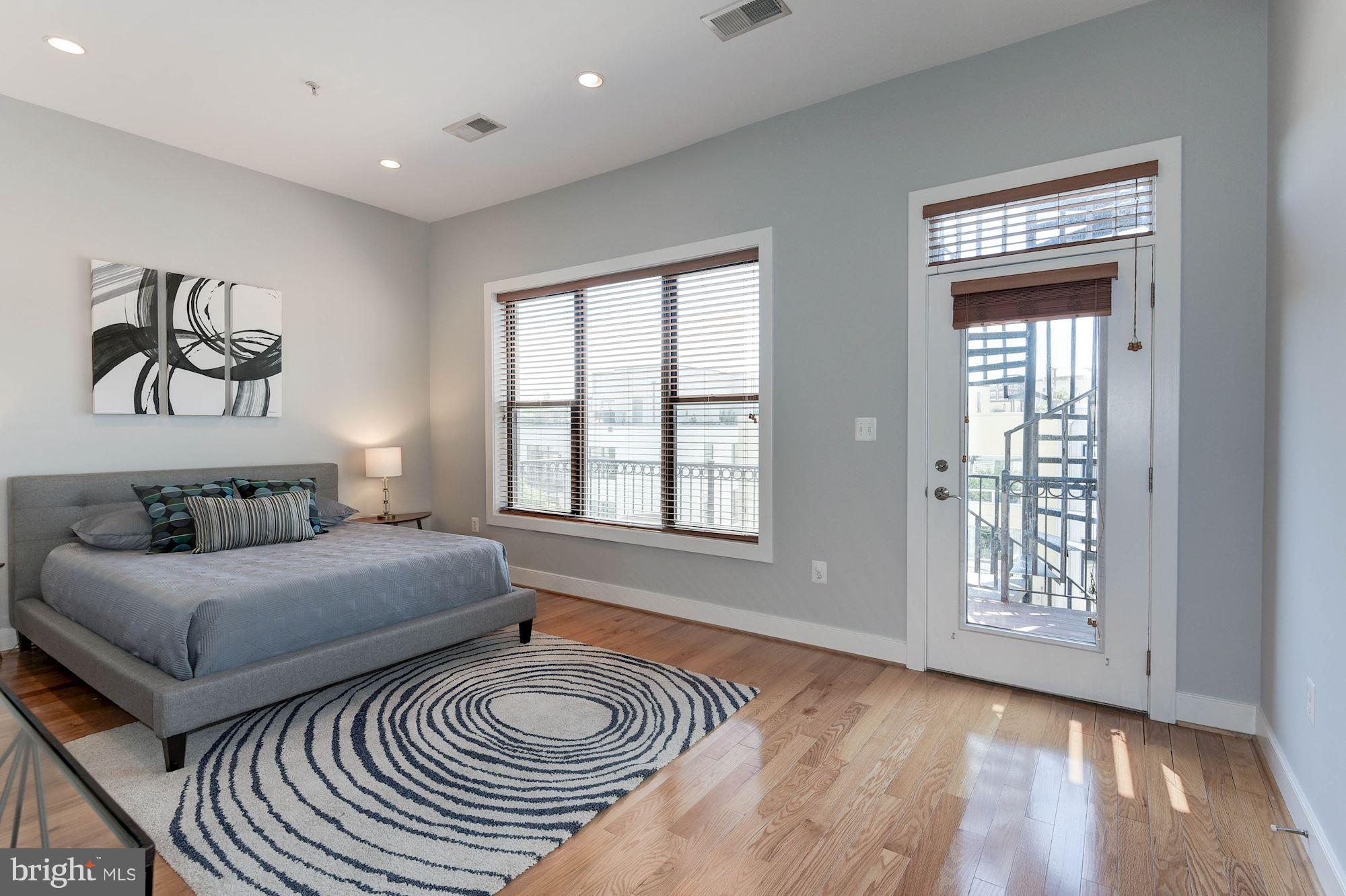 2444 Ontario Road Northwest, Unit 4 Washington, DC 20009 - Photo 15 of 26 a bedroom with a bed and a window