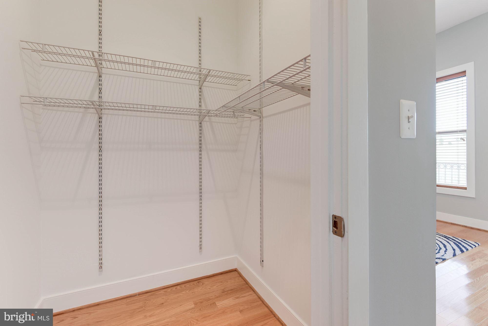 2444 Ontario Road Northwest, Unit 4 Washington, DC 20009 - Photo 18 of 26 a view of a room with racks on the wall