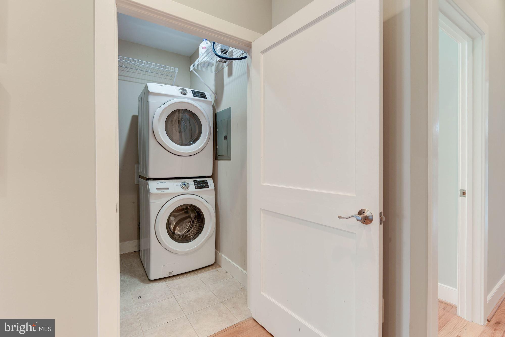 2444 Ontario Road Northwest, Unit 4 Washington, DC 20009 - Photo 22 of 26 a utility room with sink dryer and washer